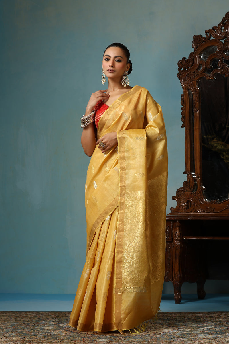 Marigold handmade light yellow-gold Kosa Silk saree with flower and leaf designs on the palla